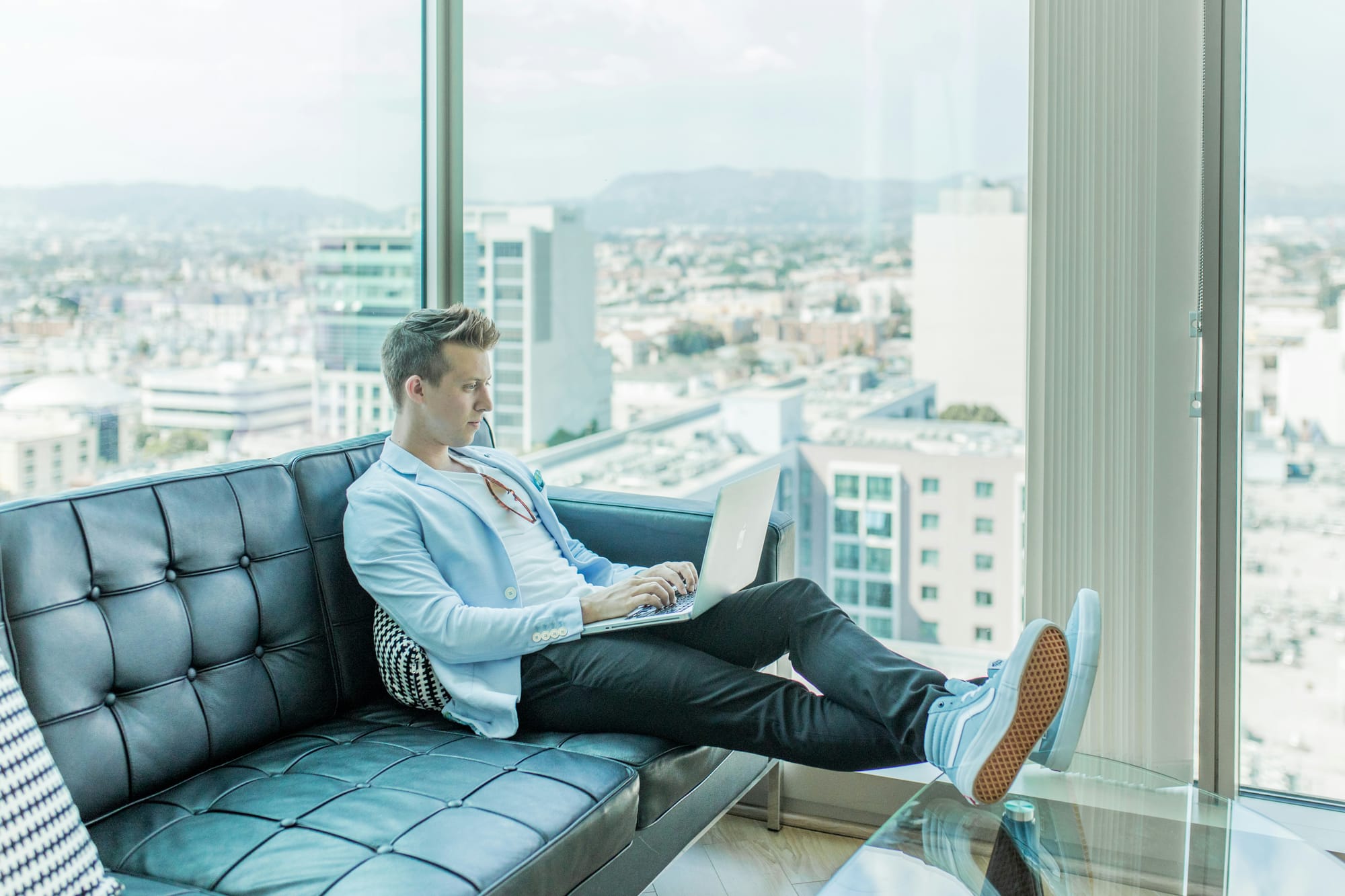young businessman in his office using marketing workflow software