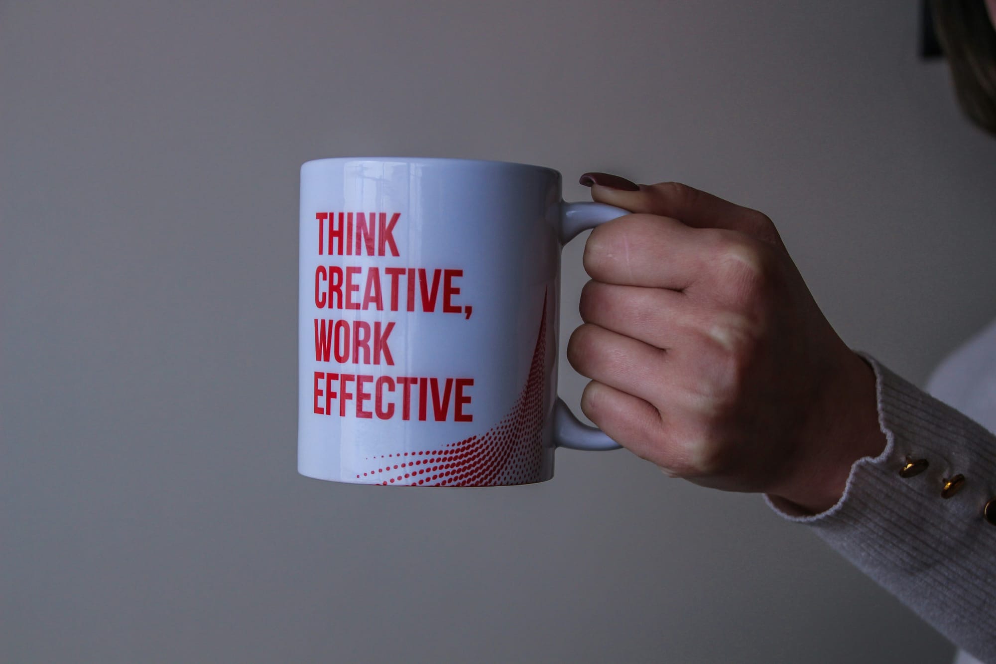 person holding creative thinking mug - Content Marketing Content Creation