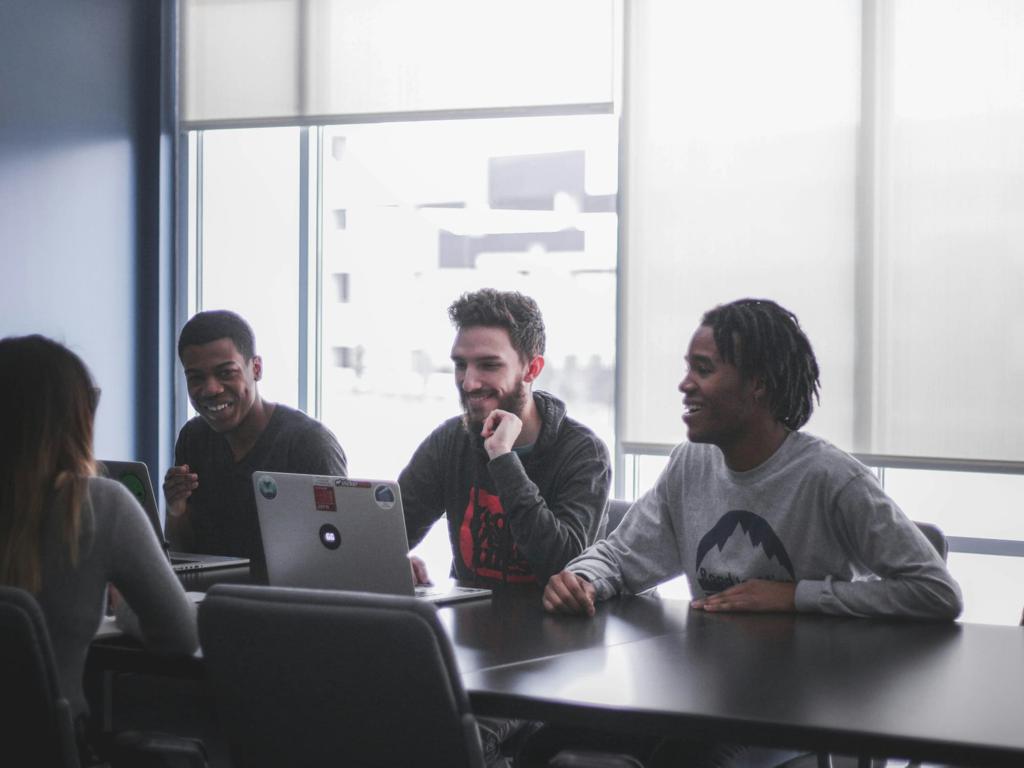 men in meeting showcasing work from No Code Platform