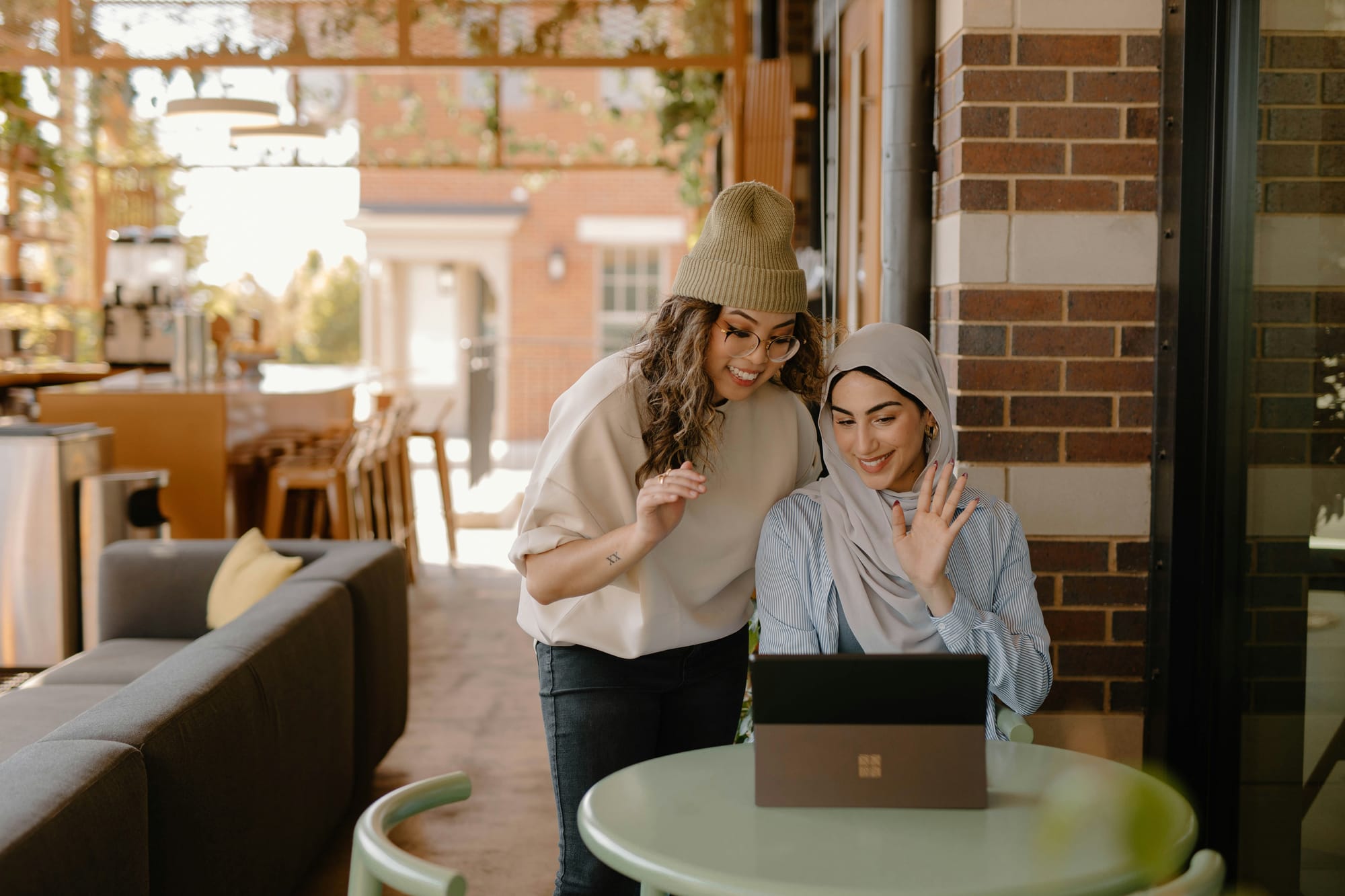 Holistic Guide On Content Creation - Two Women Smiling At A Lead That Came Through Content Creation