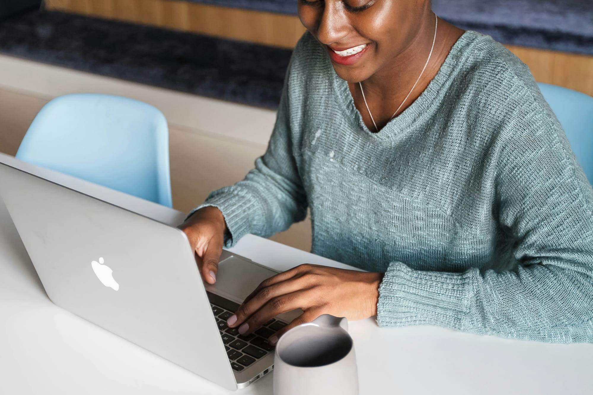 woman happily using the best no-code workflows