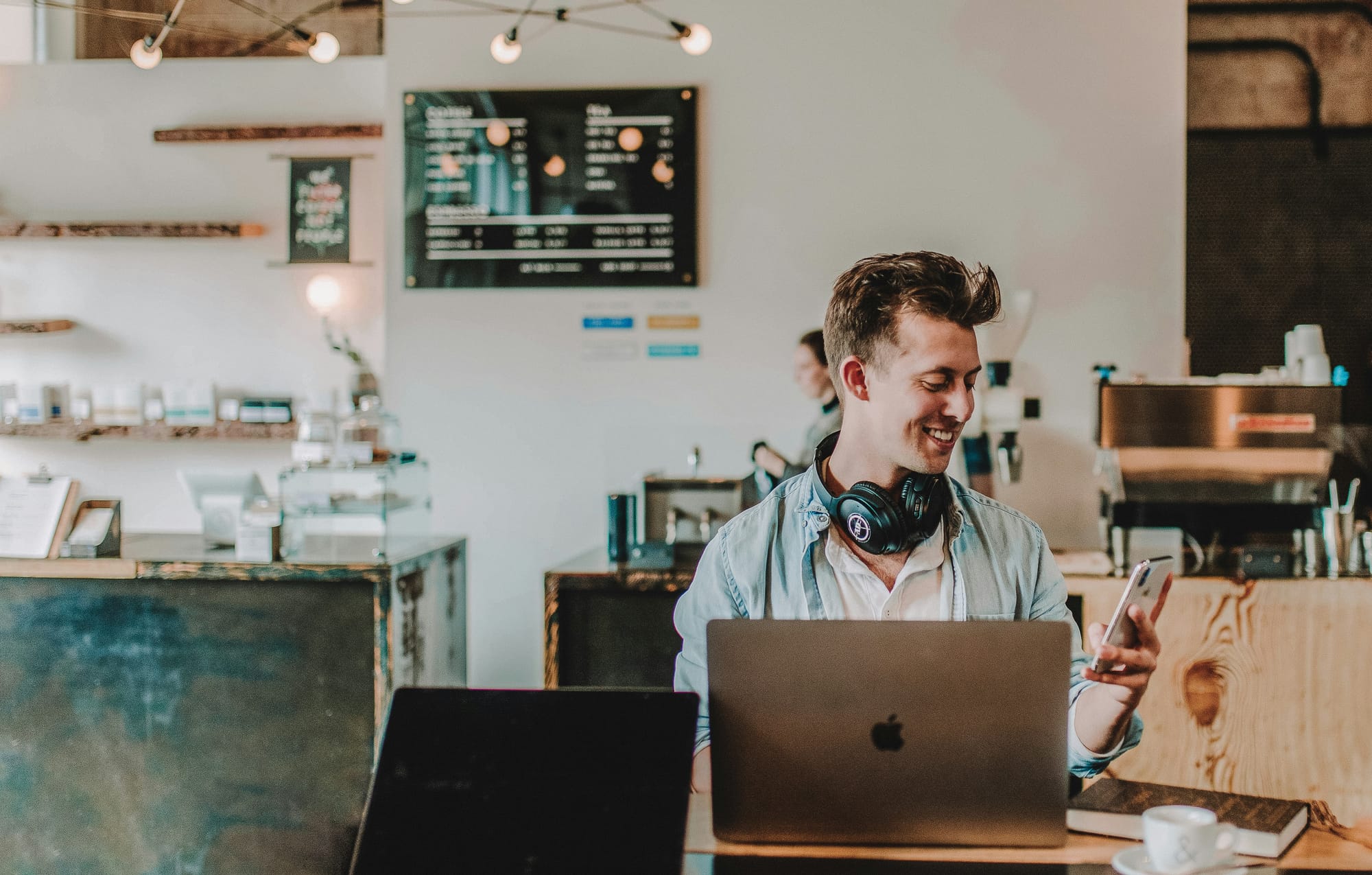 woman happily looking at his mail - Cold Email Copywriting