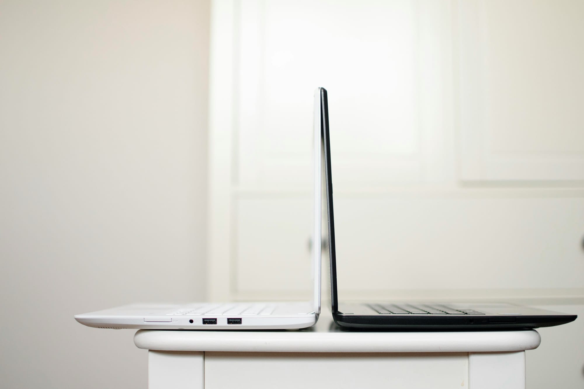 laptops on a table - Legal Workflow Automation Software