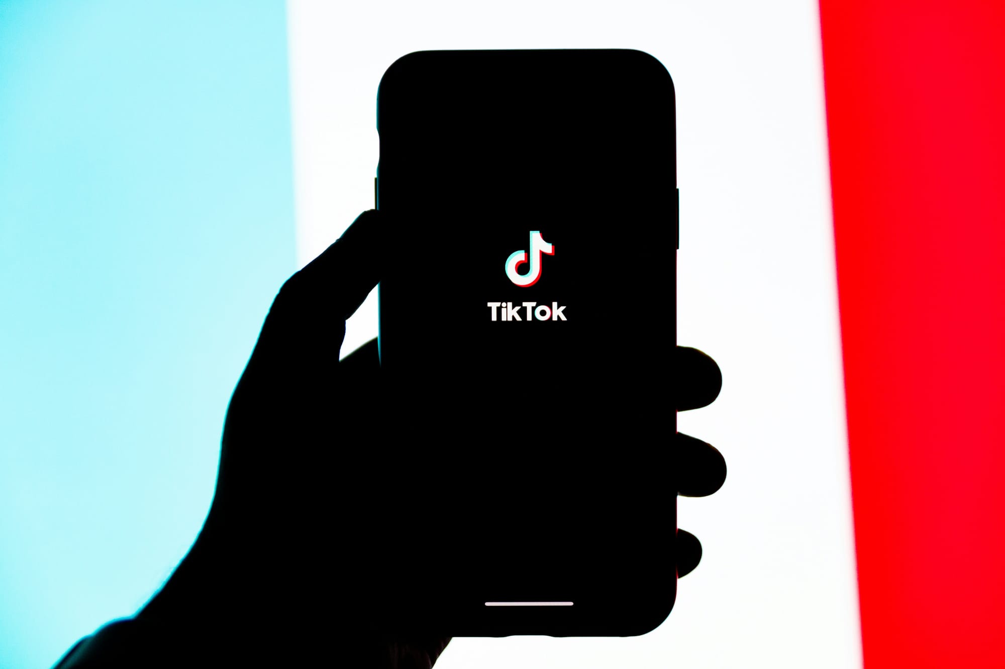 person holding mobile with tiktok - Content Creation Ideas For Tiktok