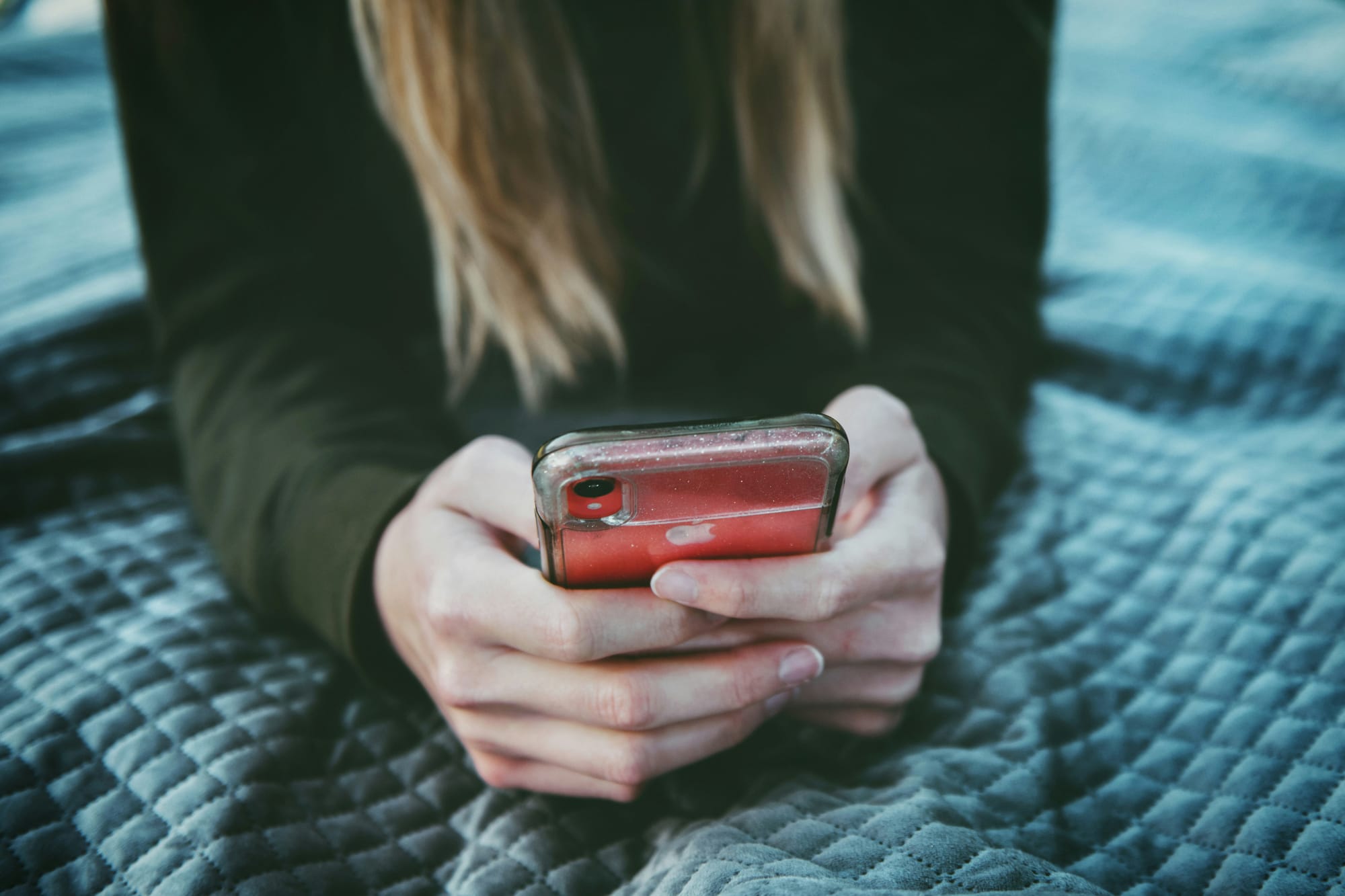 woman looking at her mobile - Social Media Automation