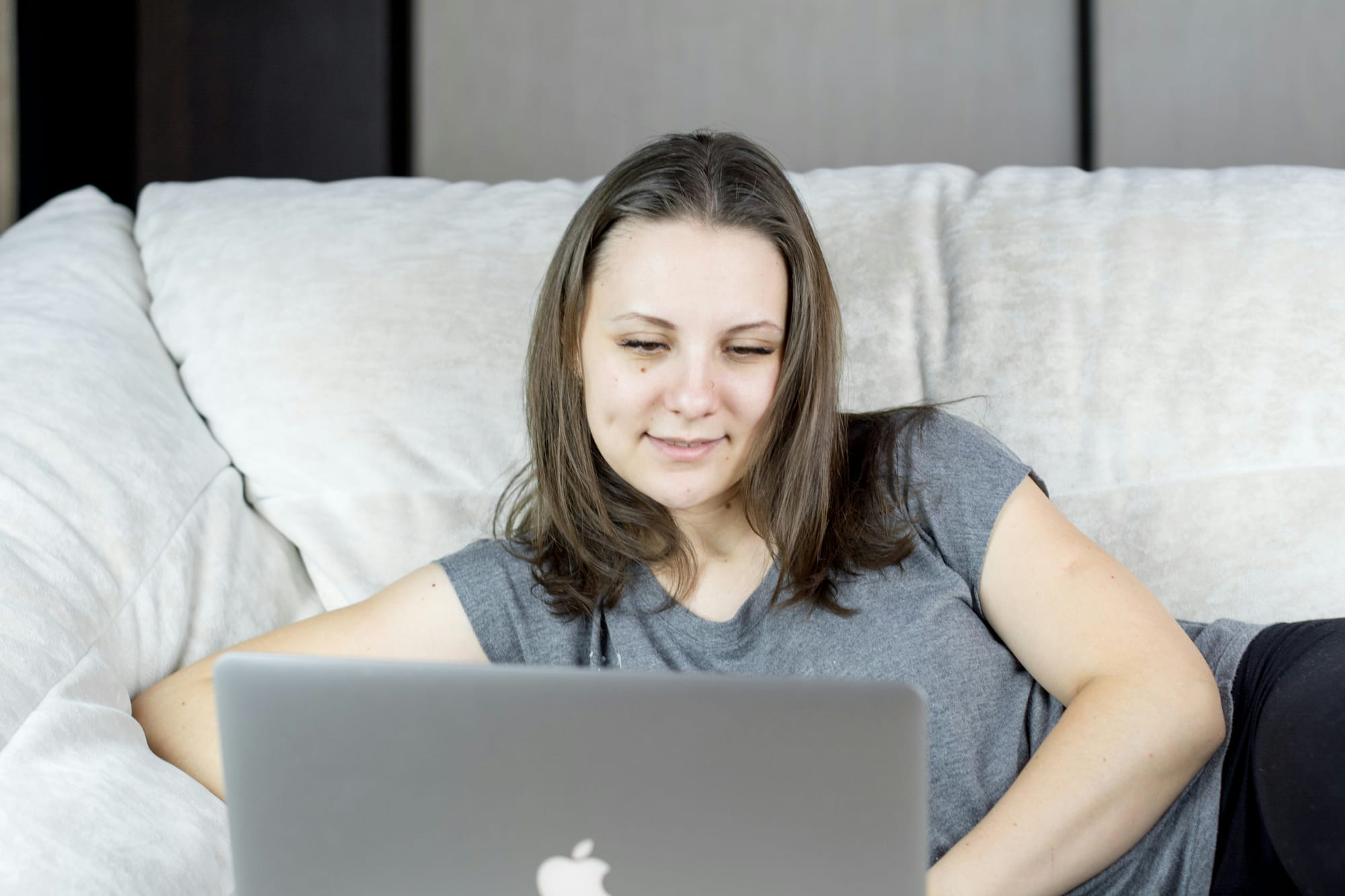 woman on couch using methods for Content Scaling