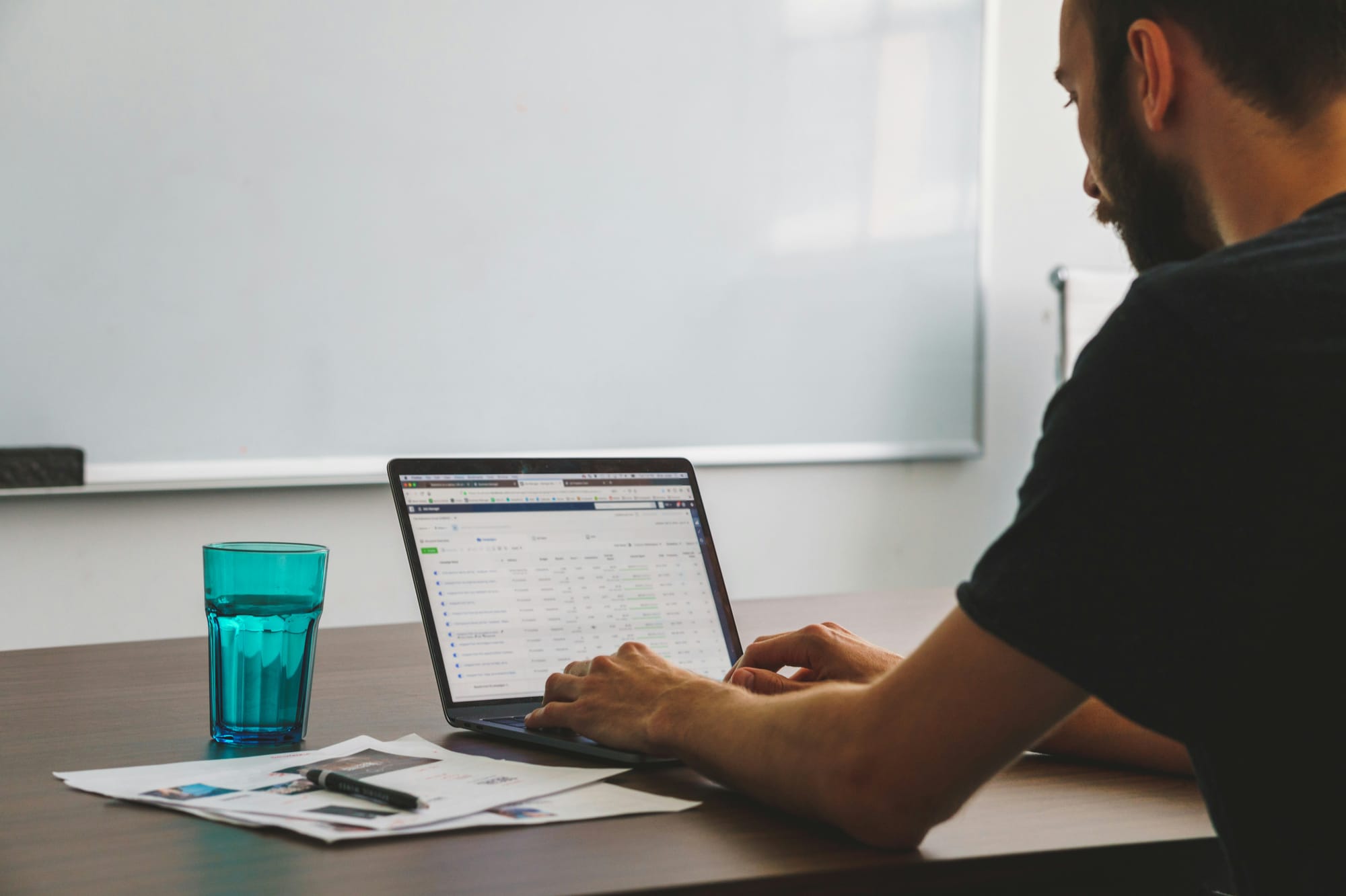 man working on laptop on Content Automation Tools