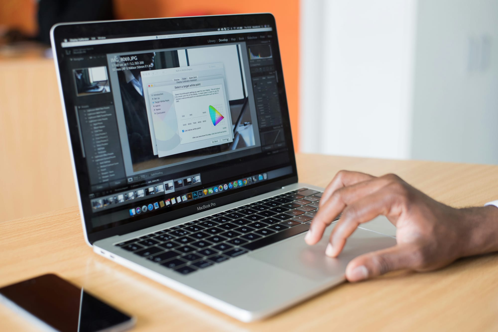 man typing Instantly Cold Email on a laptop