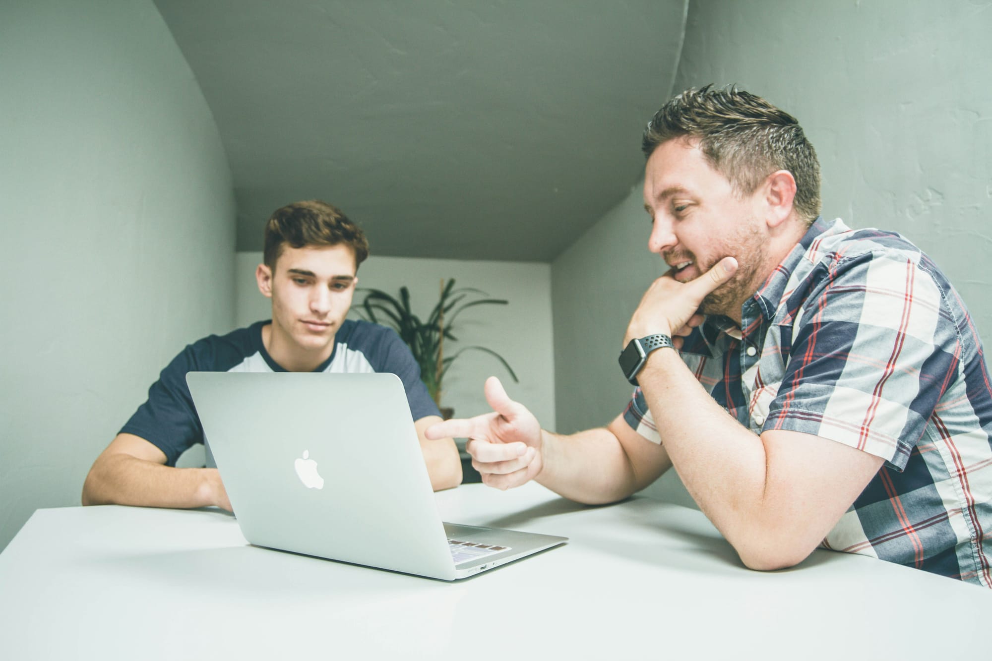 person using laptop showing to his collegue Instantly Cold Email