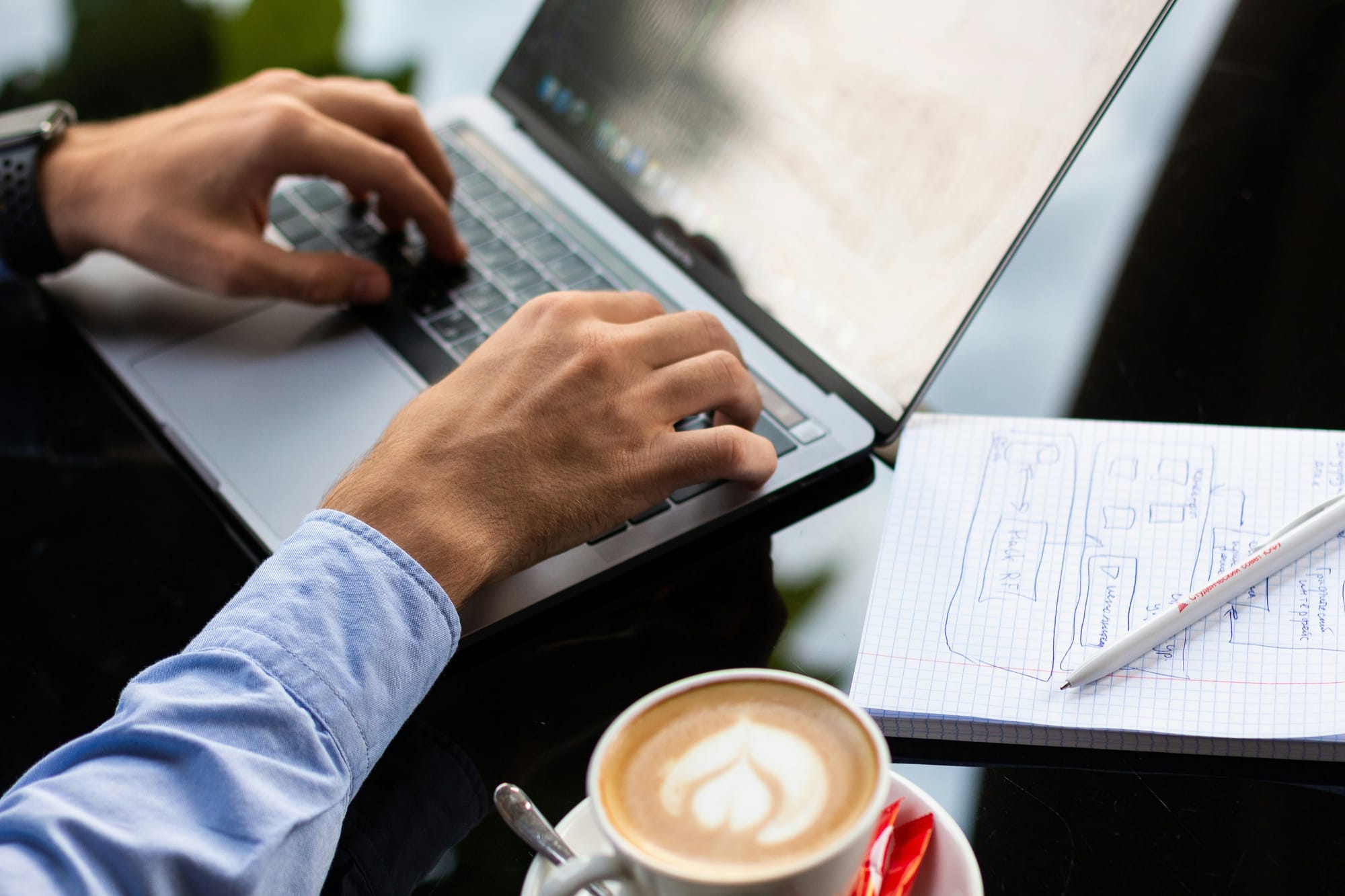 man with notes working on content repurposing workflow